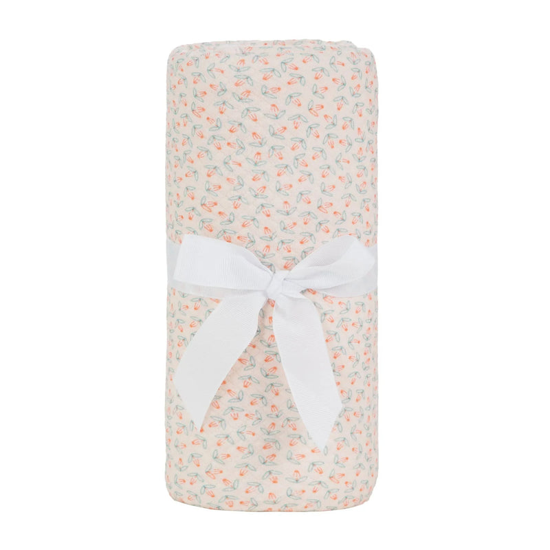 knit blanket in cream with pink and green floral pattern made from soft breathable material