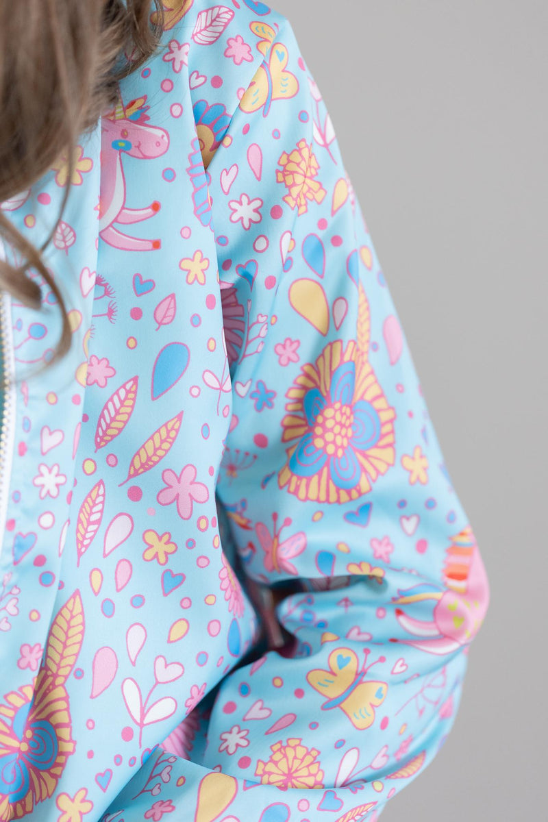 Group of friends wearing matching Blue Retro Unicorns Satin Jackets, showcasing their fun and trendy fashion sense.