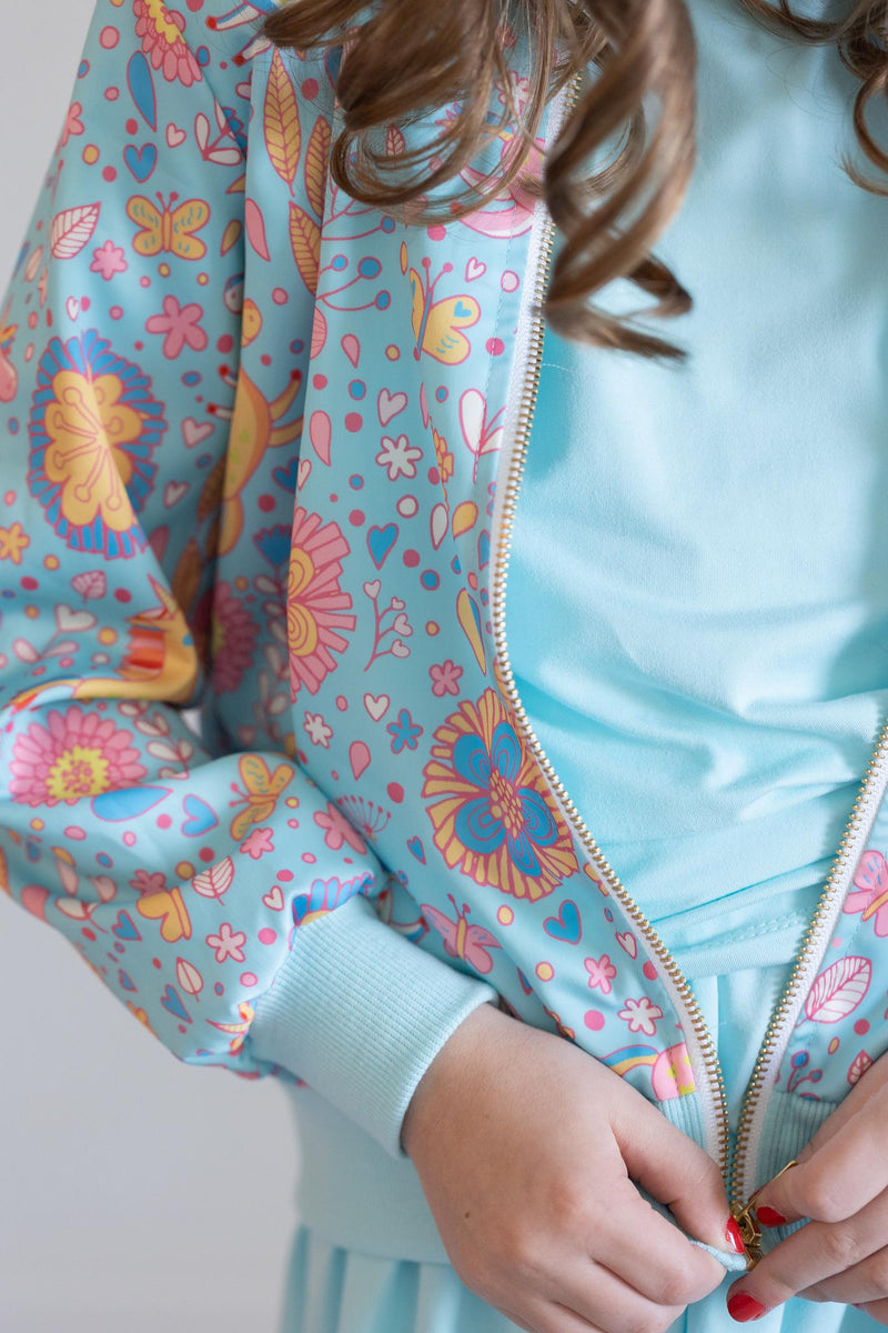 Front view of the Blue Retro Unicorns Satin Jacket by Mila & Rose, featuring playful unicorn designs on a striking blue background, perfect for whimsical outfits.