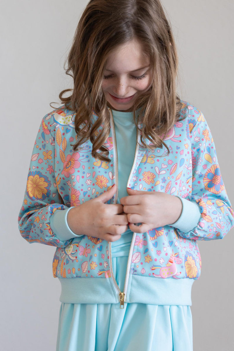 Back view of the Blue Retro Unicorns Satin Jacket, illustrating its comfortable fit and lightweight material for all seasons.