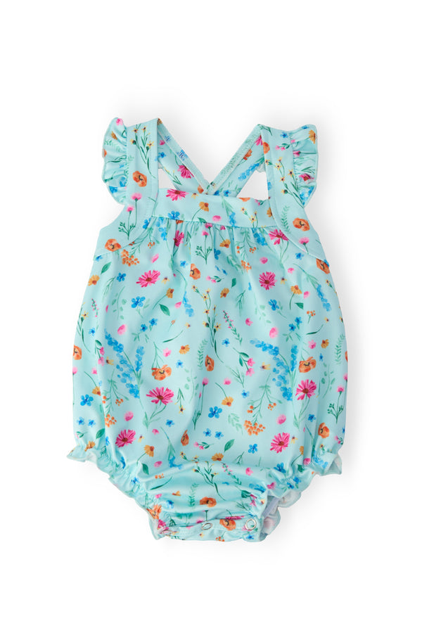 Bluebell Breeze Ruffle Cross Back Romper in light blue floral print with crisscross back straps, ruffles, and snaps