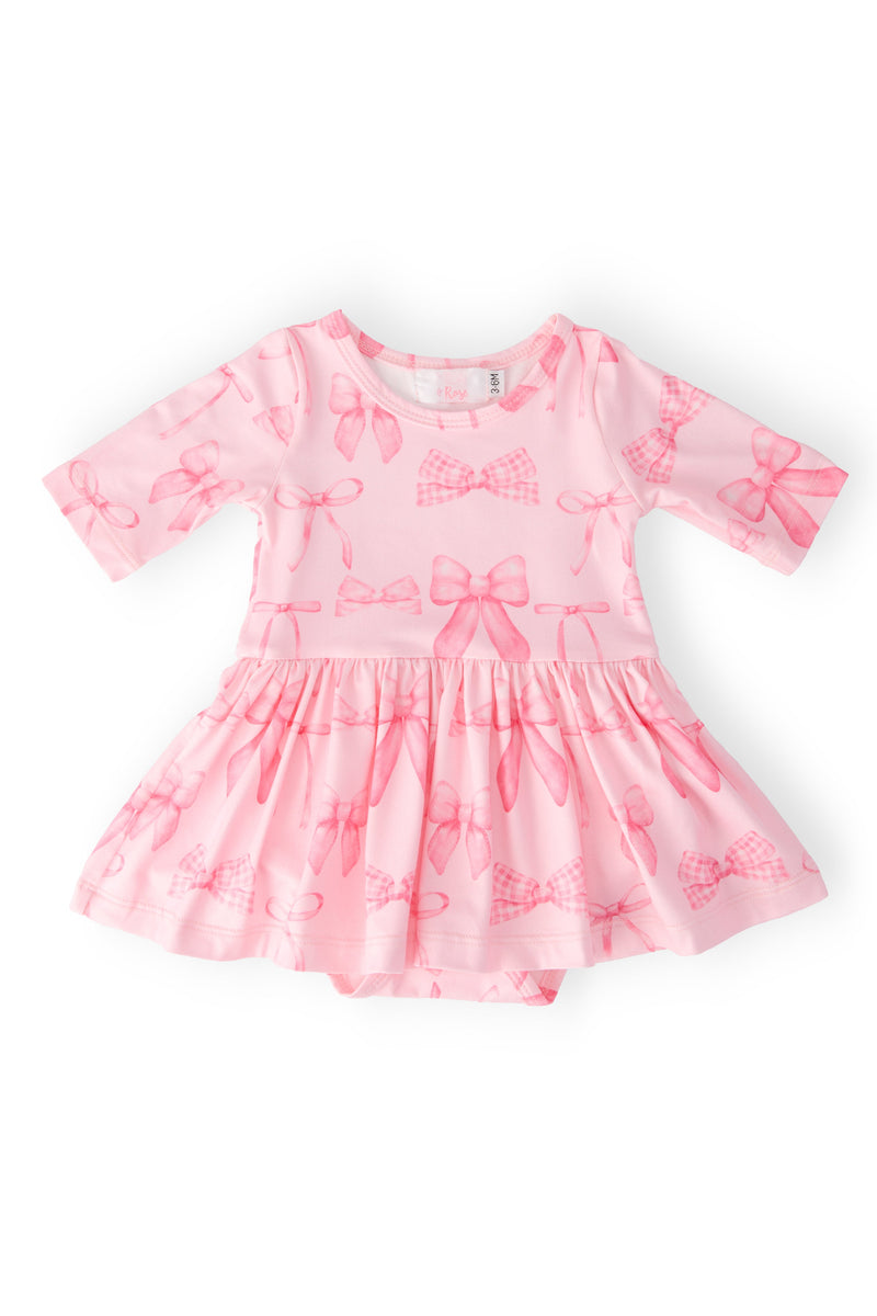 Blushing Bows 3/4 Sleeve Twirl Bodysuit by Mila & Rose, featuring a vibrant and playful design perfect for little ones who love to twirl and play.