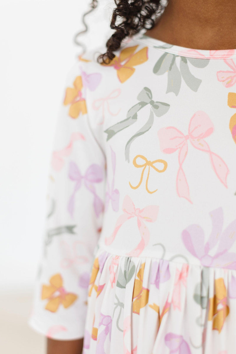 Boho Bows 3/4 Sleeve Pocket Twirl Dress on a child, showcasing its twirl design and fun pockets.