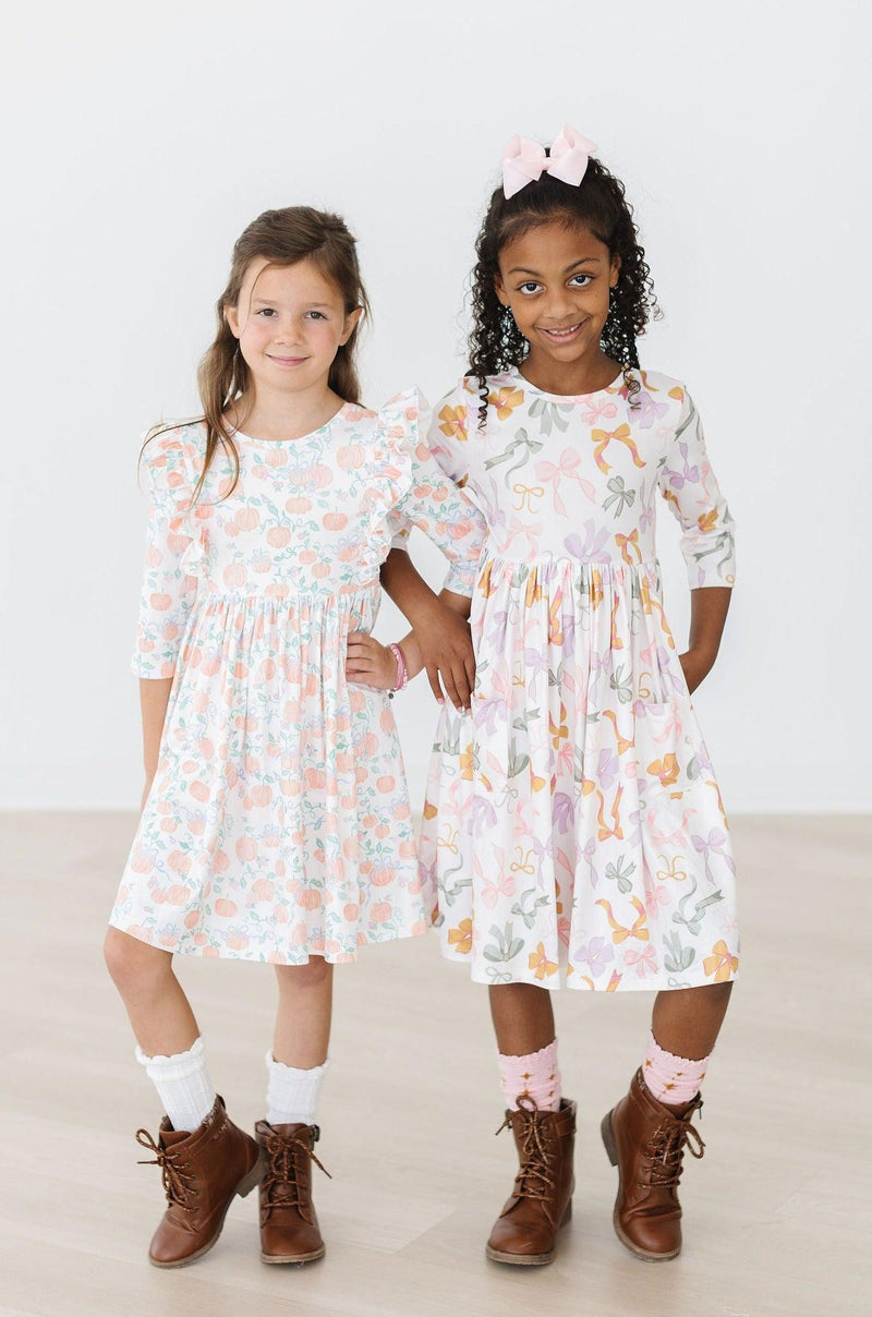 Close-up of Boho Bows 3/4 Sleeve Pocket Twirl Dress fabric, highlighting its comfortable and stretchy material.