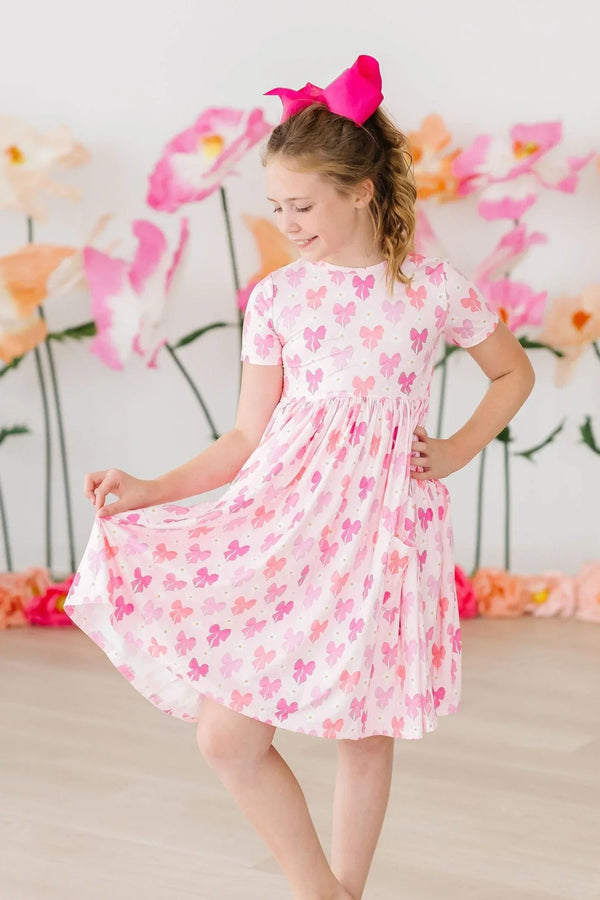 Girls pink bow twirl dress for girls short sleeve with butterfly print and matching pink hair bow