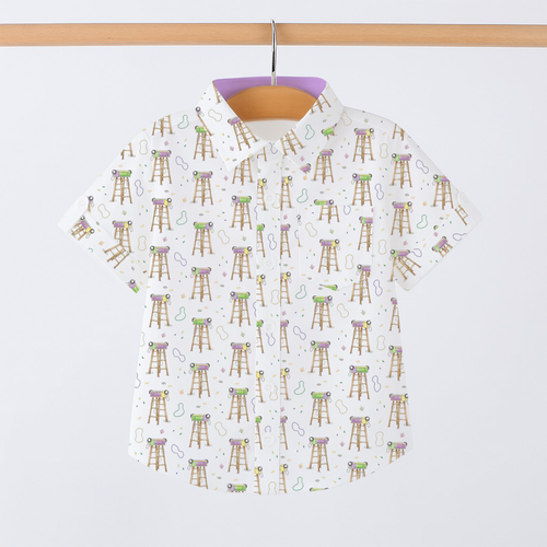 White short-sleeve collared shirt for kids with Mardi Gras ladder and bead print, hung on a wooden rod.