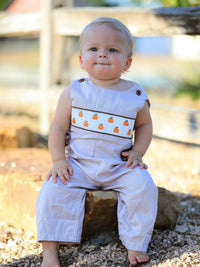 Baby boy in pumpkin-embroidered smocked romper for Fall Halloween & Thanksgiving
