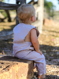 Baby in Fall Halloween and Thanksgiving Pumpkin Smock Embroidered Boys Romper outdoors, back view