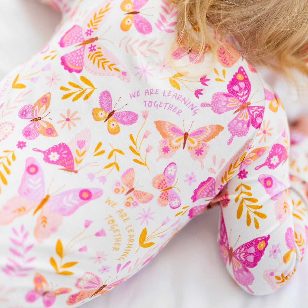 Butterfly-print fabric from The Second-Skin Convertible Romper in Raising Mama viscose from bamboo.