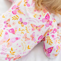 Butterfly-print fabric from The Second-Skin Convertible Romper in Raising Mama viscose from bamboo.