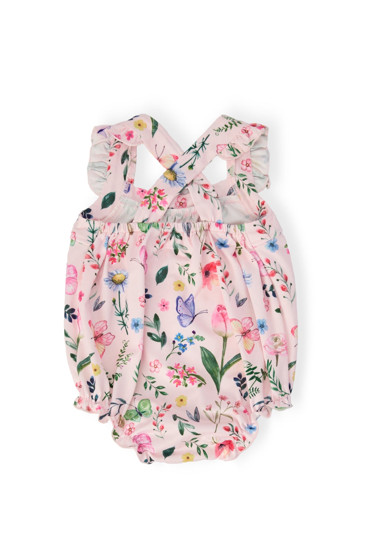 Butterfly Meadows Ruffle Cross-Back Romper in pink floral print with crisscross straps, shoulder ruffle, snaps.