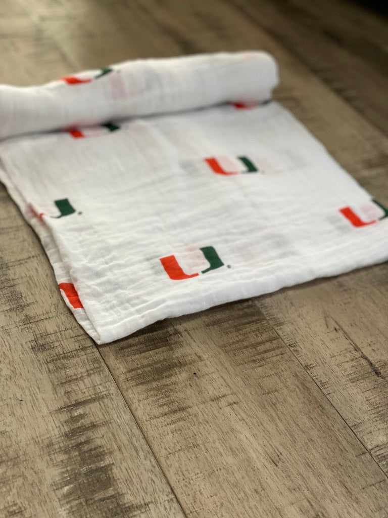 University of Miami Hurricanes Muslin Swaddle Blanket – Soft Breathable 47x47 Baby Blanket – Officially Licensed The U Newborn Gift