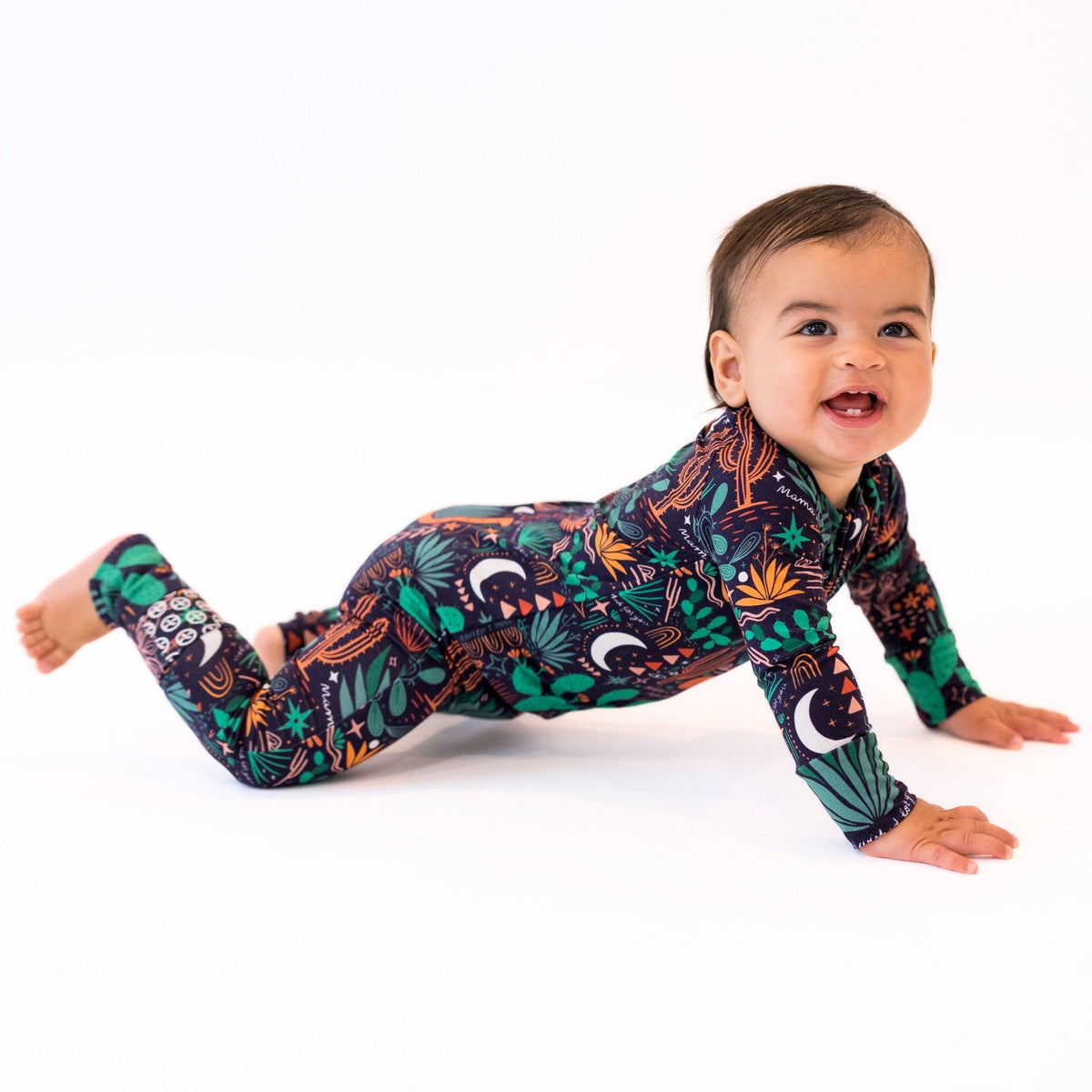Baby in The Second-Skin Convertible Romper, Desert Cactus Midnight, bold botanical print.