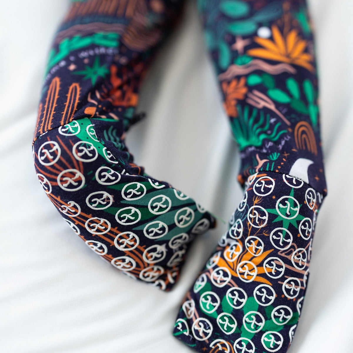 The Second-Skin Convertible Romper Desert Cactus Midnight fabric close-up.