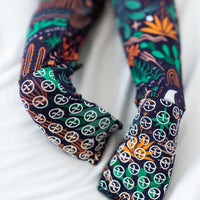 The Second-Skin Convertible Romper Desert Cactus Midnight fabric close-up.
