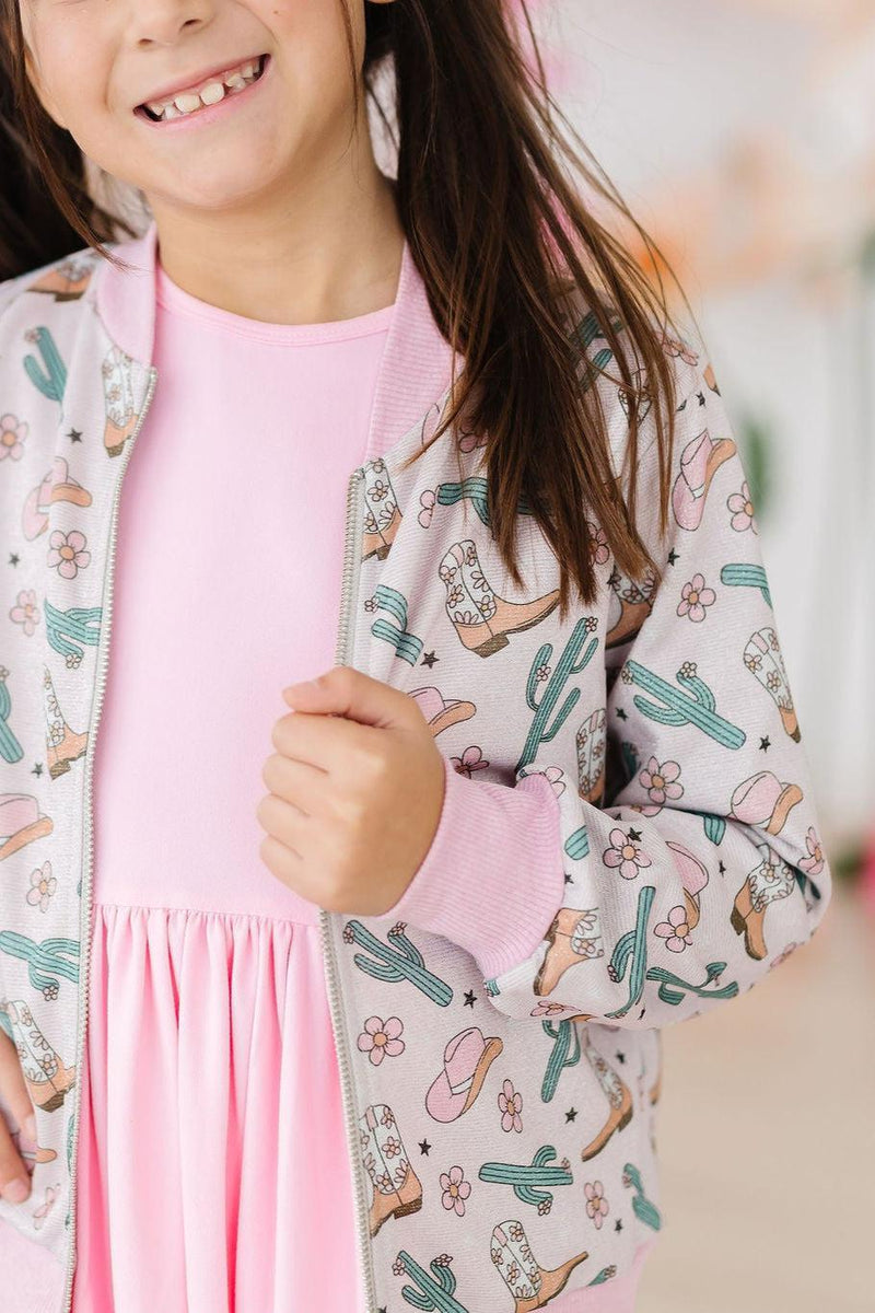 Cactus Cowgirl Shimmer Jacket - Girls styled with twirl dresses, exemplifying playful fashion and shimmer.