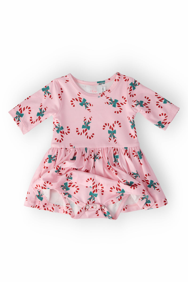 Top view of the Candy Cane Cutie 3/4 Sleeve Twirl Bodysuit in pink, showcasing its playful candy cane pattern and elegant twirl skirt.