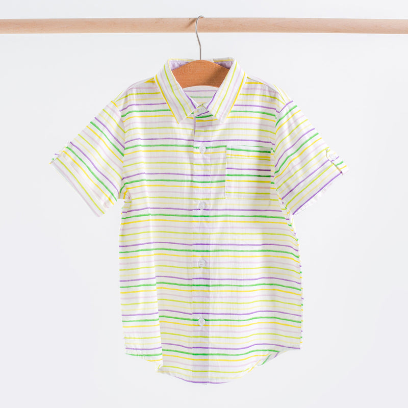 Carnival Time short-sleeve collared shirt in purple, green, and gold stripes on white, hanging on a wooden hanger