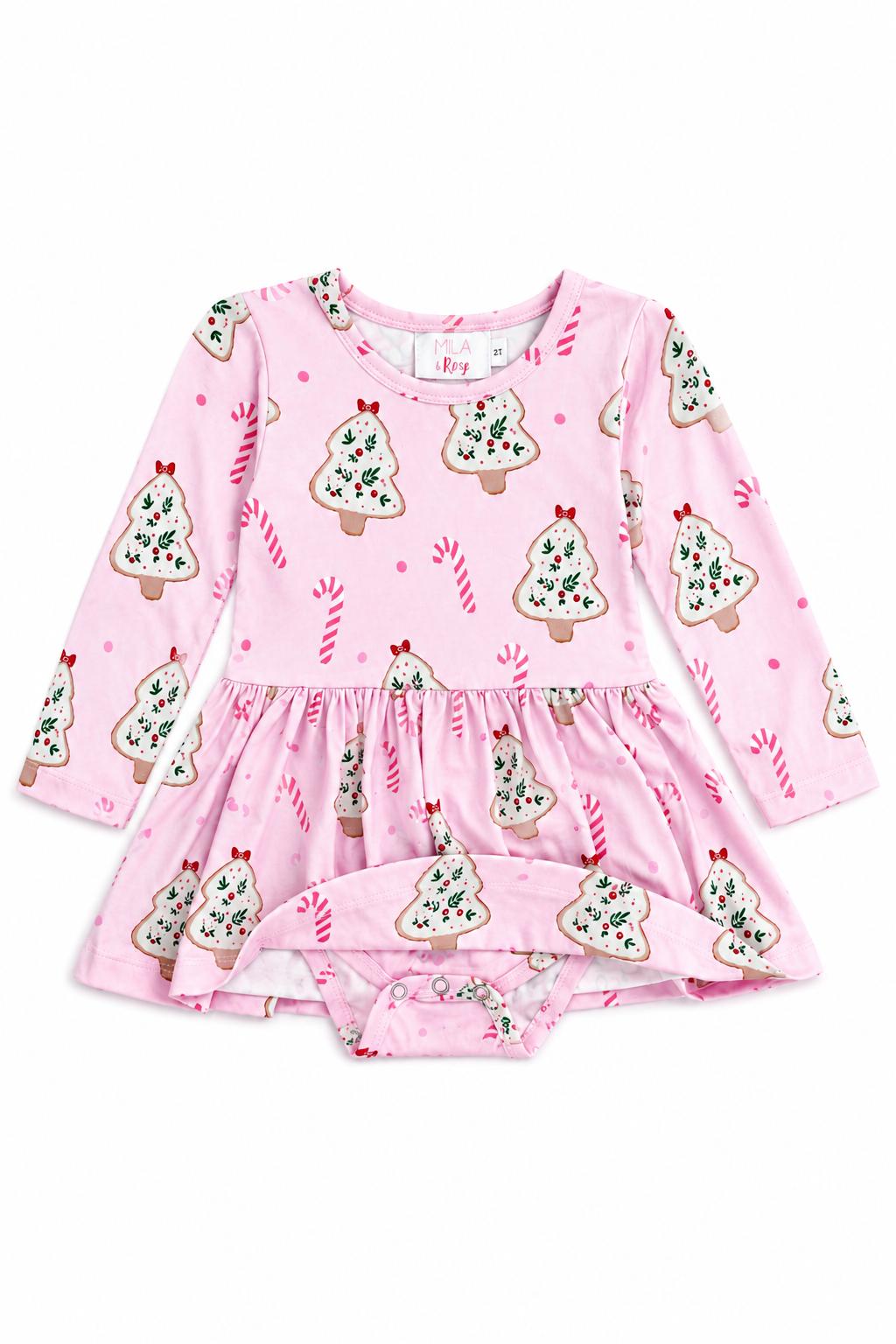 Pink long sleeve twirl bodysuit with Christmas cookie and candy cane print, featuring snap closure for easy diaper changes.