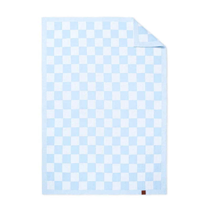 Light blue and white checker jacquard knit baby blanket flat lay with folded corner revealing texture against white