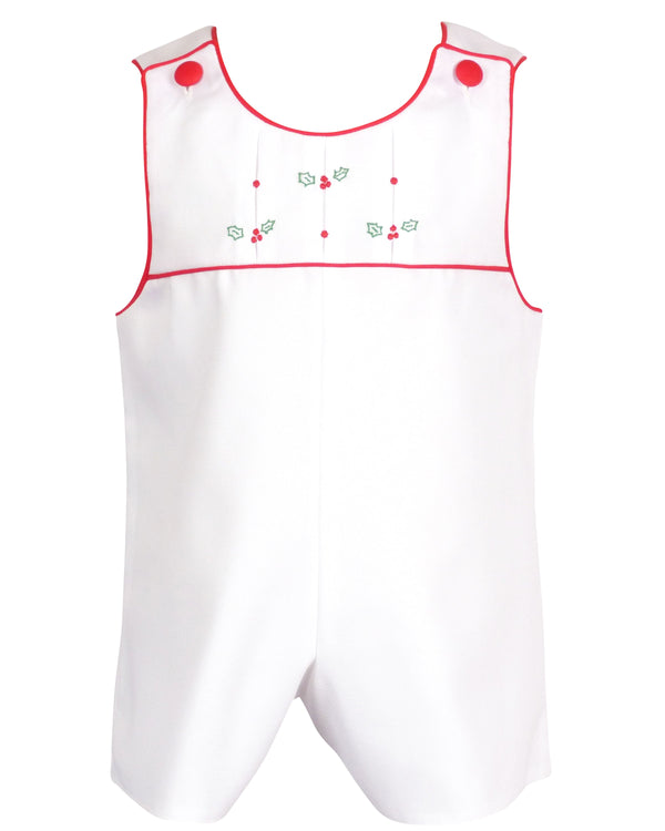 White cotton pique baby romper with pleated yoke, red trim, and embroidered holly berries for holiday wear.