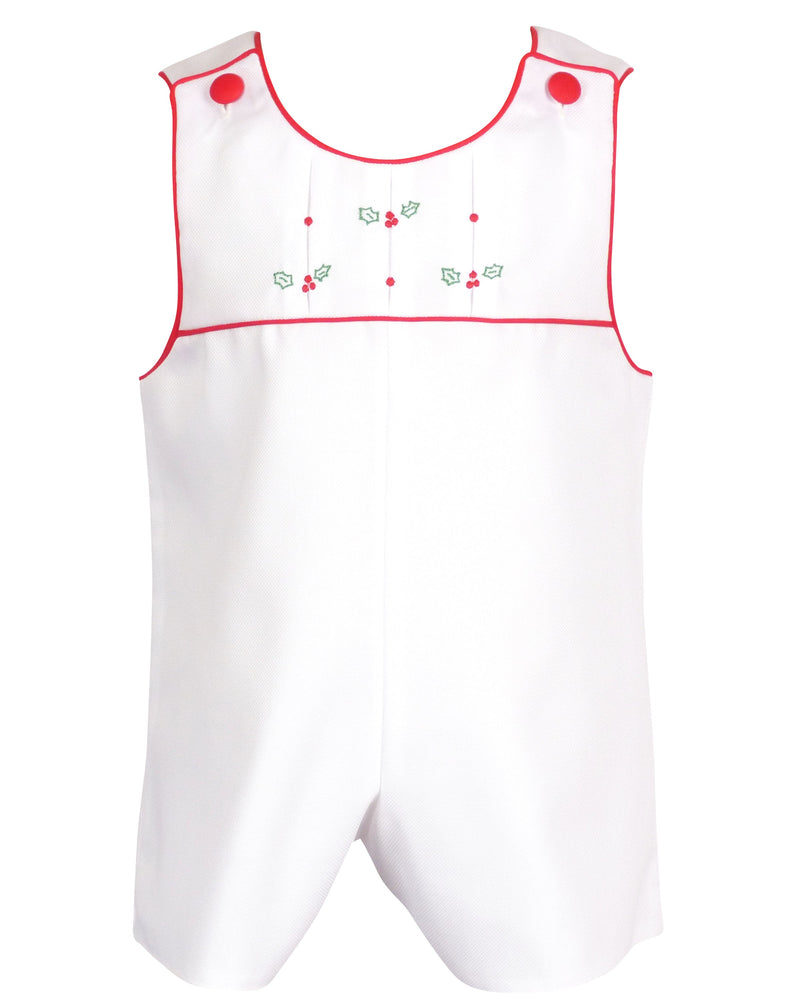 White cotton pique baby romper with pleated yoke, red trim, and embroidered holly berries for holiday wear.