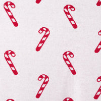 Extreme close up of white reverse side showing intricate knit weave and red motifs