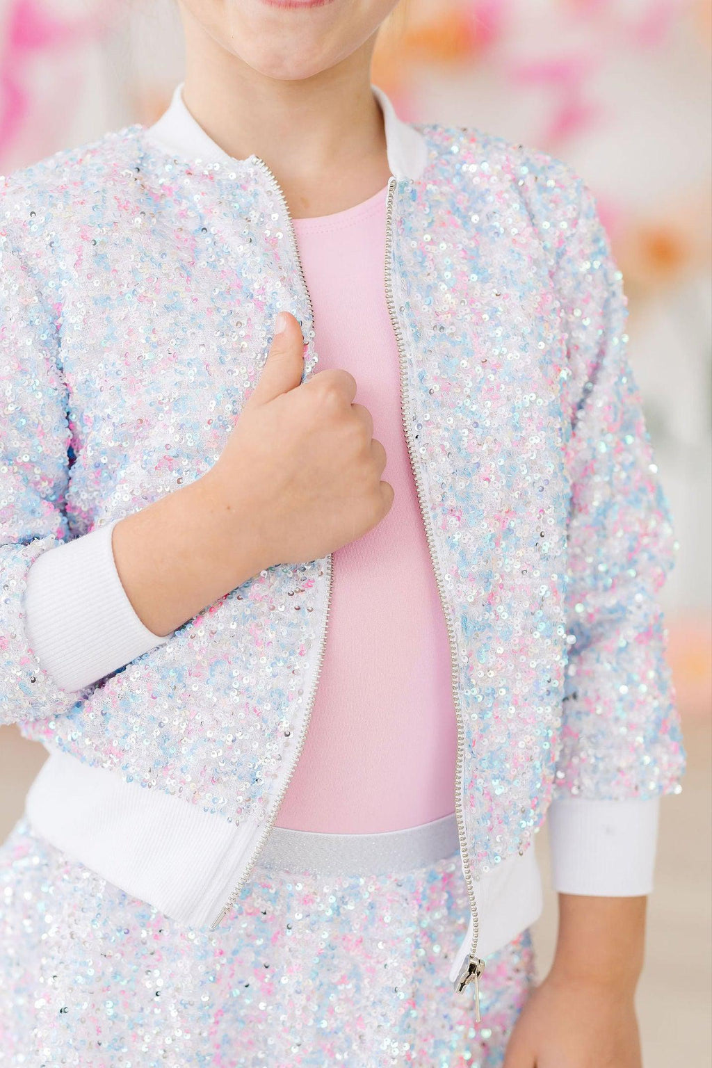 Cotton Candy Sequin Jacket for Girls - Zippered Front displayed on a smiling girl, showcasing the stunning sequin design and comfortable fit, perfect for any occasion.