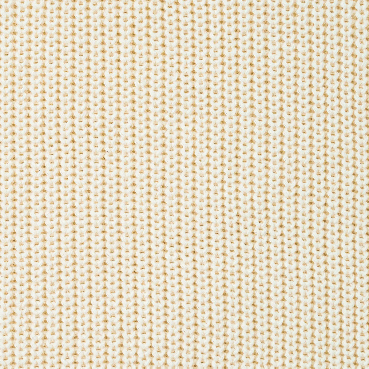 Macro close-up of cream knitted fabric texture highlighting soft breathable cotton ribbed stitch pattern