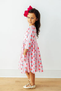 Close-up of the Daisy Chain Three Quarter Sleeve Pocket Twirl Dress with a scoop back and ballet neckline, emphasizing its features as a girls pocket twirl dress.