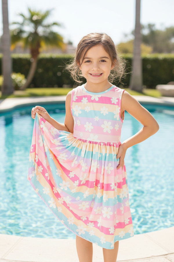 children standing by the pool in a colorful dress