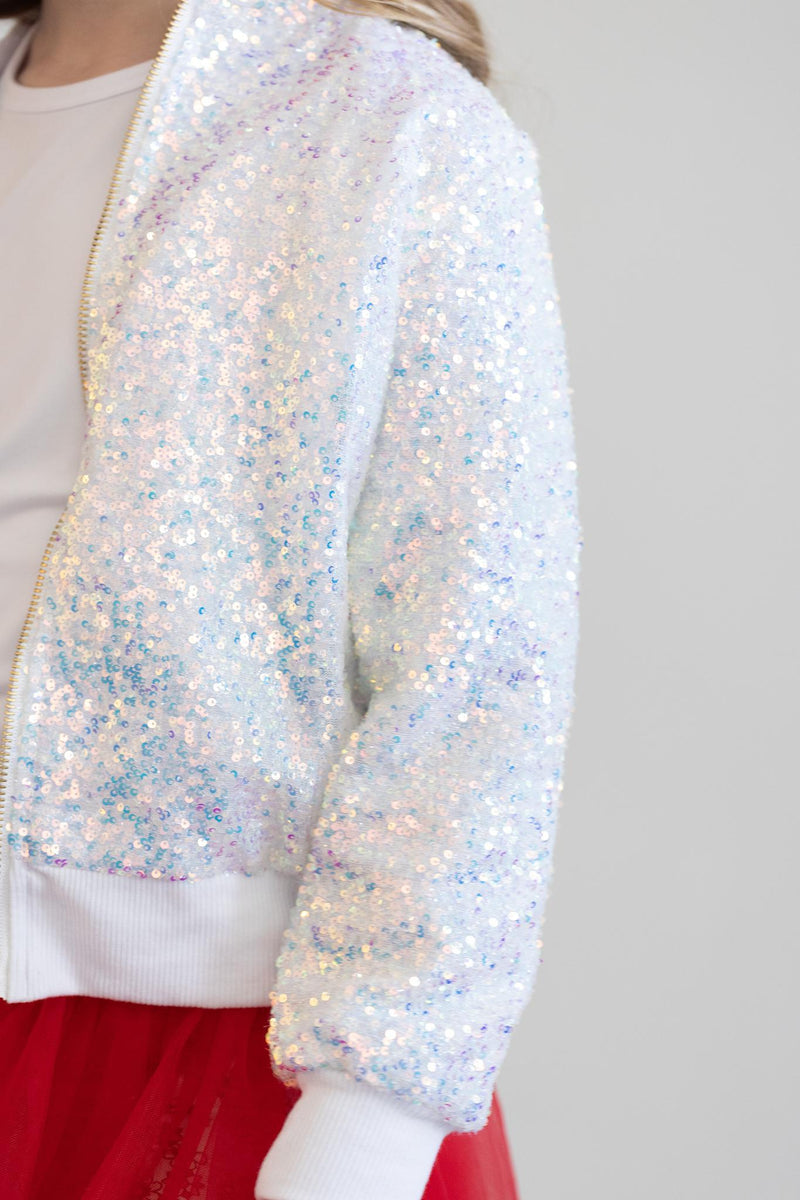 Close-up of a child in the SALE Disco Sequin Jacket by Mila & Rose, highlighting the dazzling sequins and stylish design suitable for any occasion.