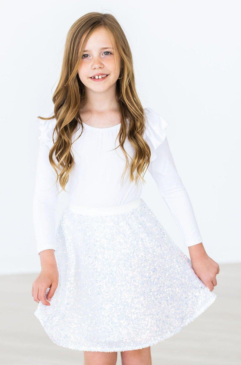 SALE Disco Sequin Twirl Skort for Girls in White, showcased by a girl with long hair, highlighting the fun and fashionable flair of this twirl skort for girls.