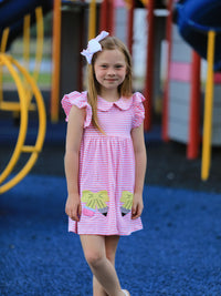 Close-up of the Ruffle Bow Pencil Twirl Dress showcasing its petal collar and playful ruffles, perfect for back to school dresses.