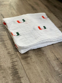 University of Miami Hurricanes Muslin Swaddle Blanket – Soft Breathable Baby Blanket – Officially Licensed The U Newborn Gift - The Palm Beach Baby