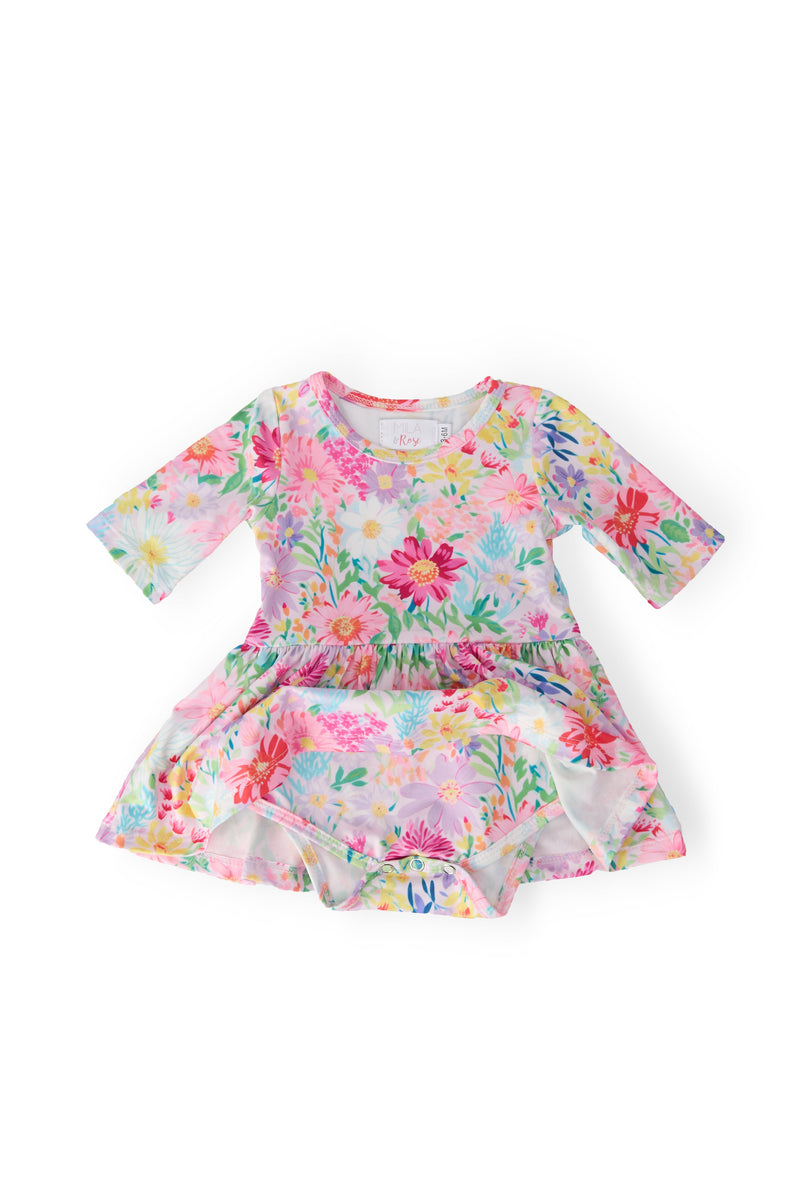 Charming baby girl wearing the Field of Flowers 3/4 Twirl Bodysuit from Mila & Rose®, ready for a delightful day filled with twirls and cheer.