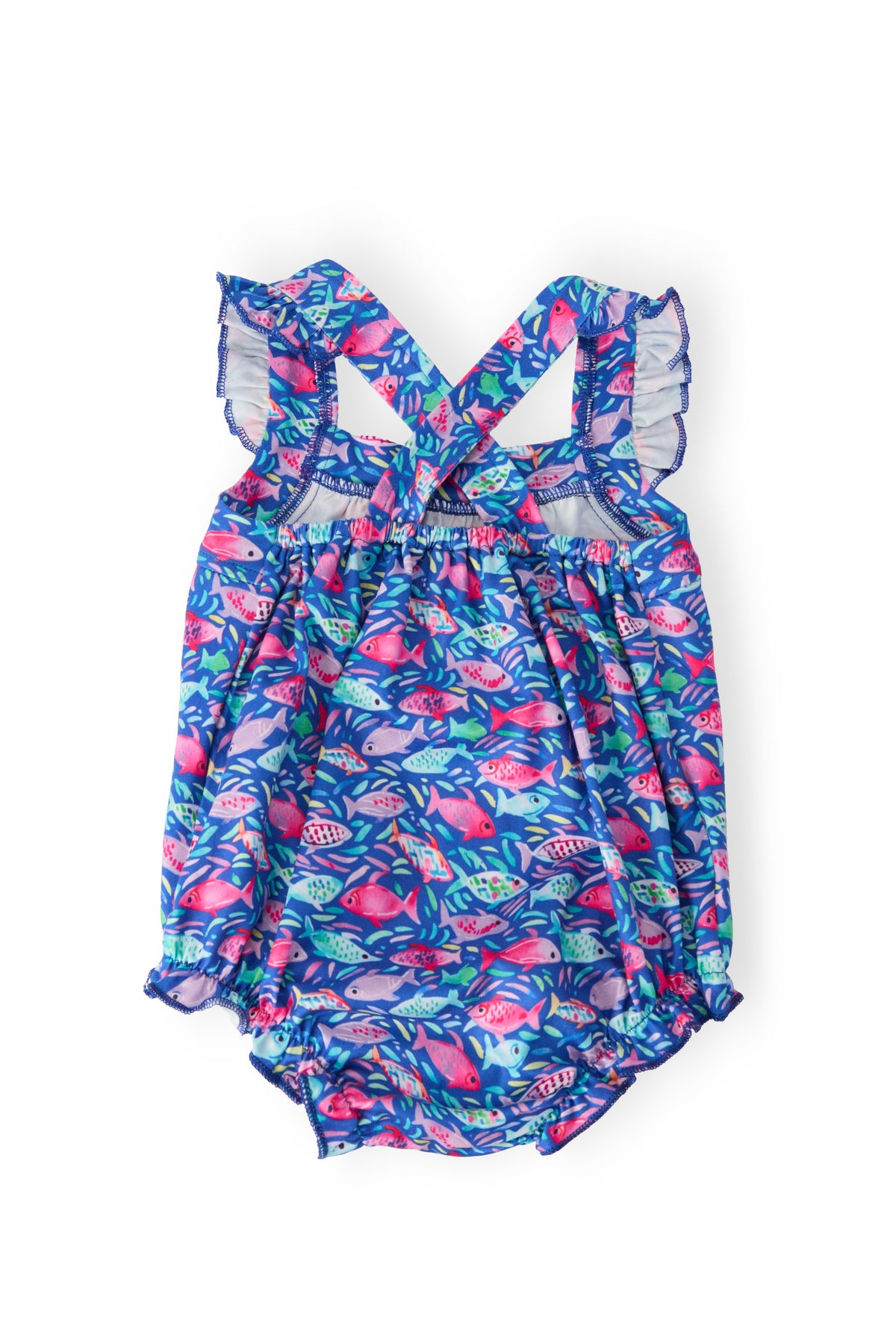 Fish in the Sea Ruffle Cross Back Romper on blue fish-print fabric with crisscross back straps and ruffled shoulders.