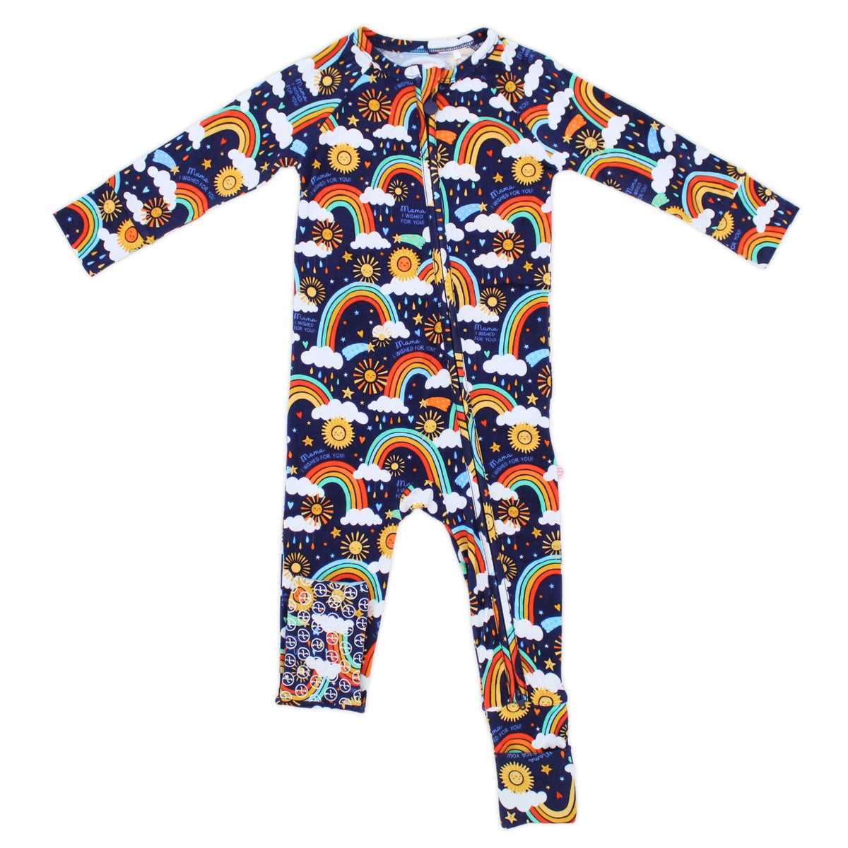 The Second-Skin Convertible Romper Here Comes the Sunshine Blue with rainbow, sun and clouds print, zip-front.