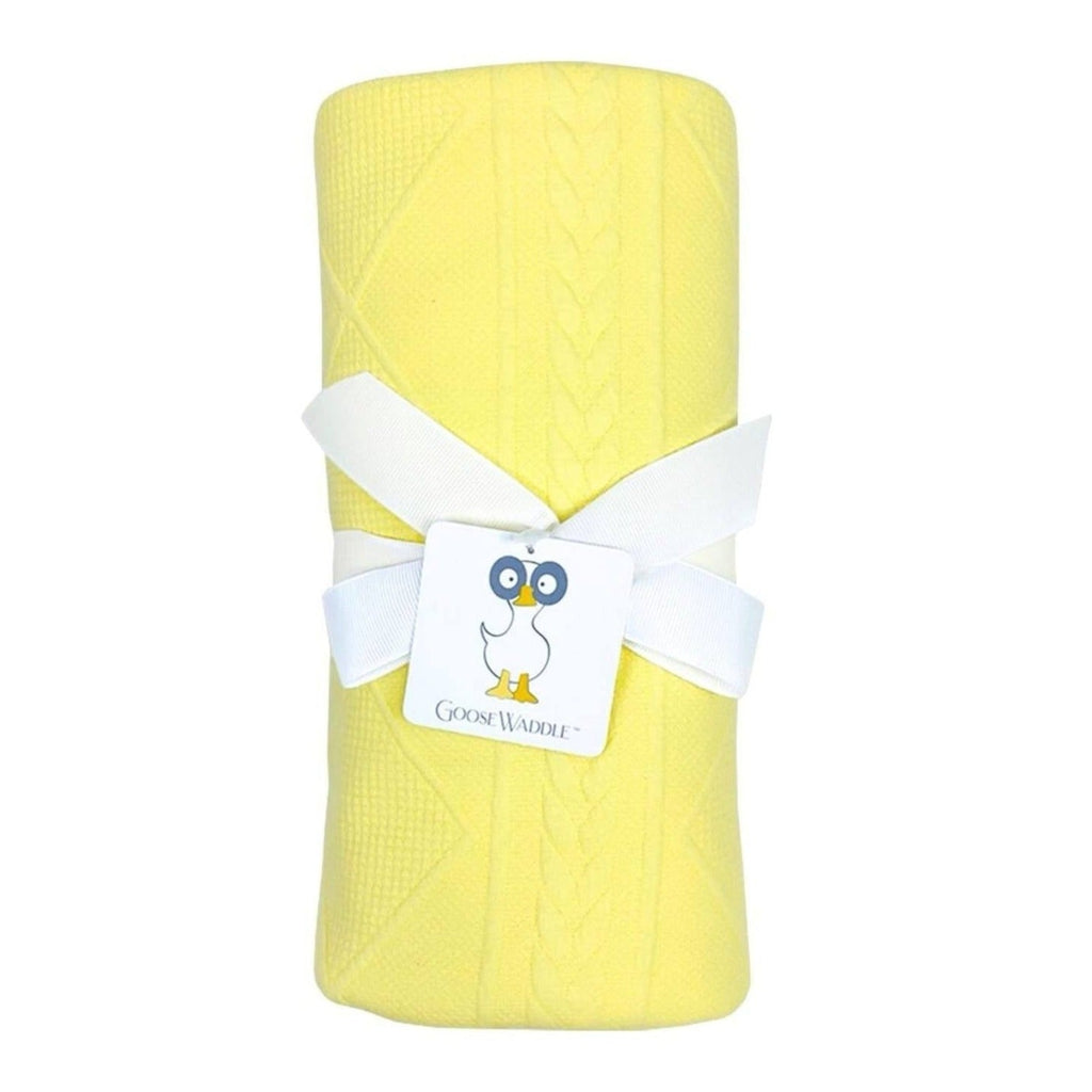 Yellow Knit Blanket by Goosewaddle® beautifully wrapped with a satin ribbon, showcasing its cozy texture and bright color.