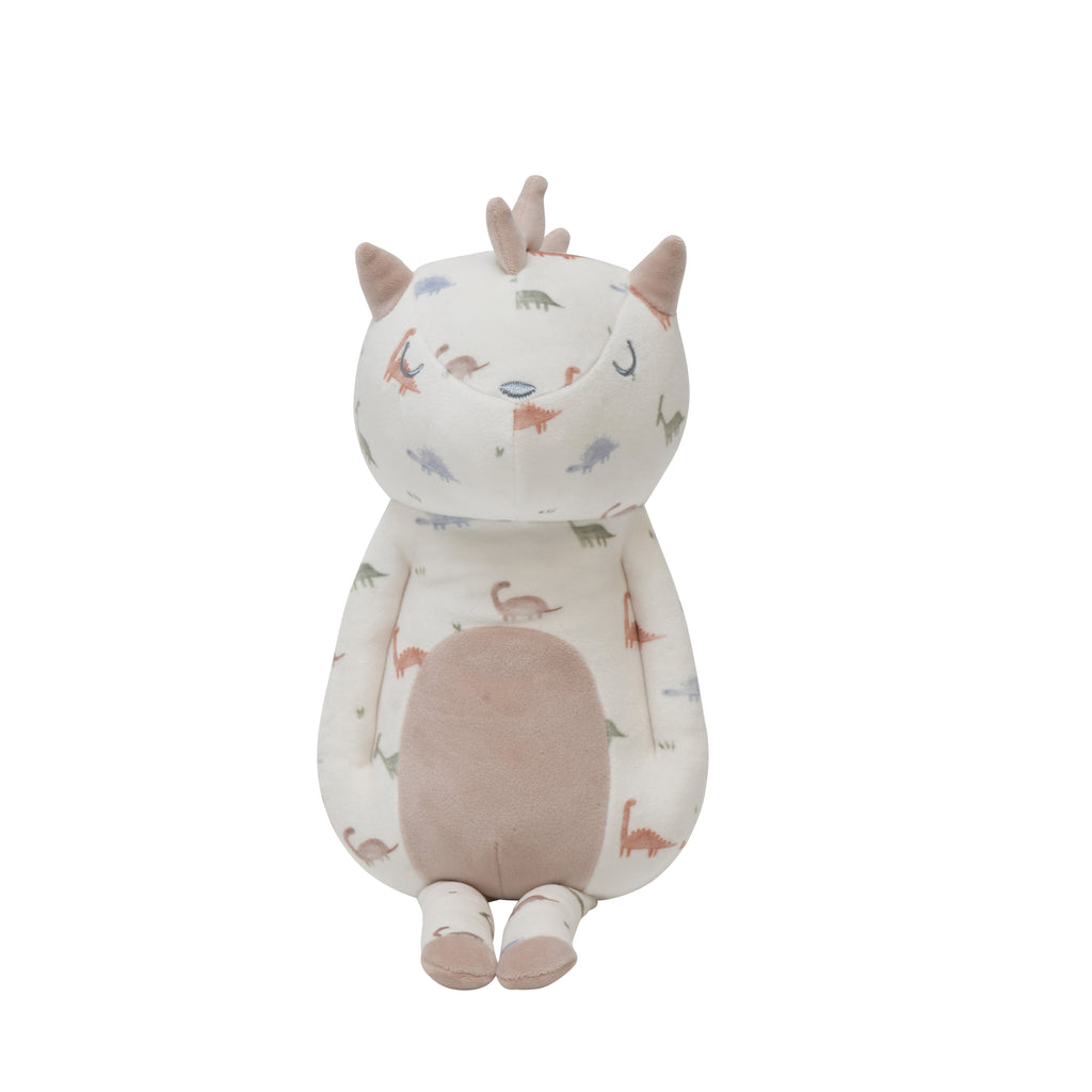 Darby Dino Mini Printed Plush sitting upright, showcasing its cute design and dinosaur print.