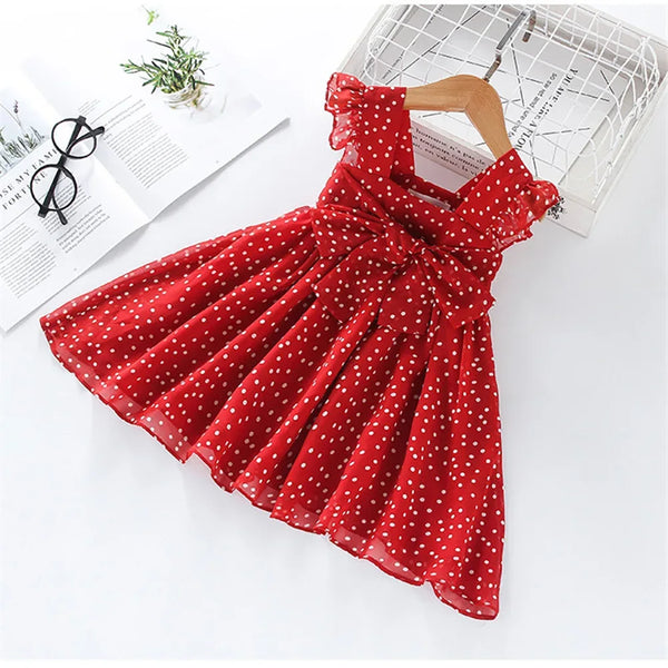 Red polka dot party dress for toddlers with ruffle sleeves and bow detail