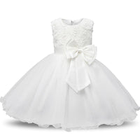 White girls tulle special occasion dress with floral lace bodice and large satin bow waist. Cotton lace blend zip closure.