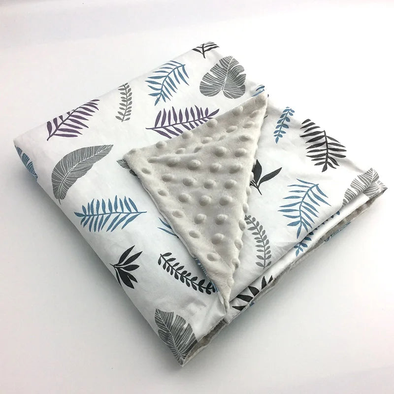 Colorful leaf-pattern dotted minky blanket, white base, soft dotted reverse, 100 x 75 cm for babies and young children.