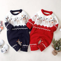 Two baby rompers, one navy and one red, with festive patterns on a light background.