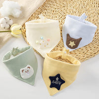 Soft cotton baby bibs with crown, star, and bear appliques. Triangle saliva towel keeps infants dry and comfortable during feeding.
