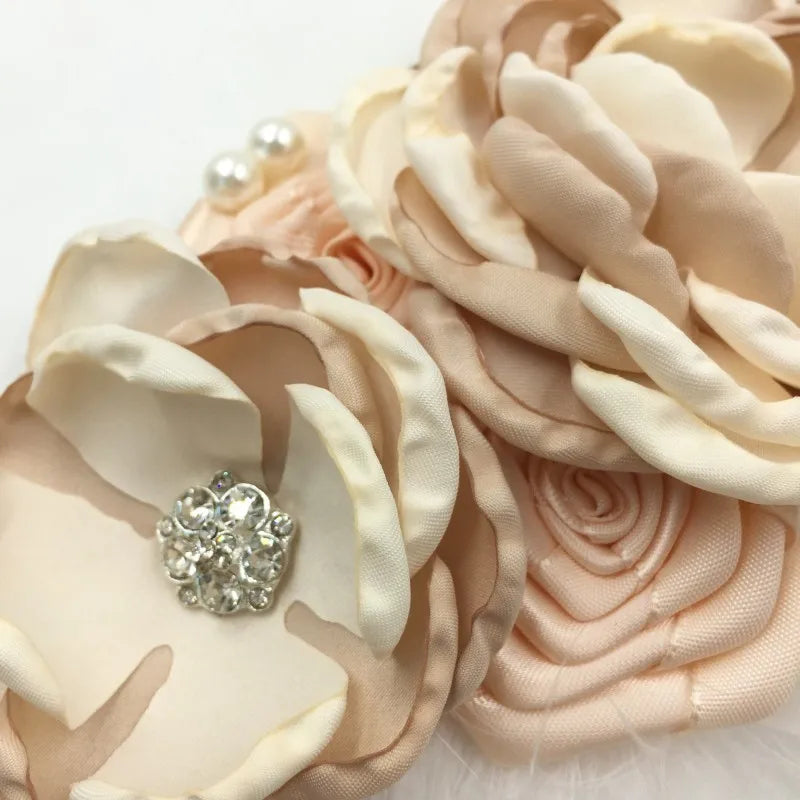 Elegant Chiffon Beaded Baby Hair Accessories featuring delicate fabric flowers with sparkling accents, suitable as a gift for newborns.
