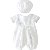 White baby romper set with matching cap. Formal special occasion bodysuit with pleated front, suspenders, and short sleeves for infants.