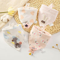 Soft cotton triangle baby bibs featuring rabbit, giraffe, and floral cartoon prints. Absorbent drool pad for feeding time.