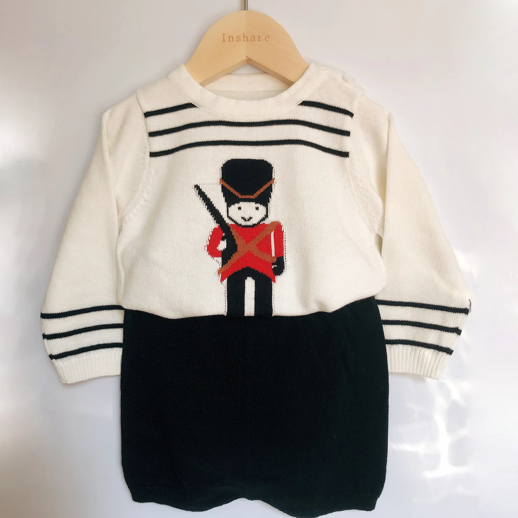 Austin Classic British Guard Preppy Knit Shorts Set featuring a playful toy soldier design on a cream knit top with black and red accents.