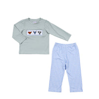 Children's pajama set with long-sleeve shirt and checkered pants on a light gray background